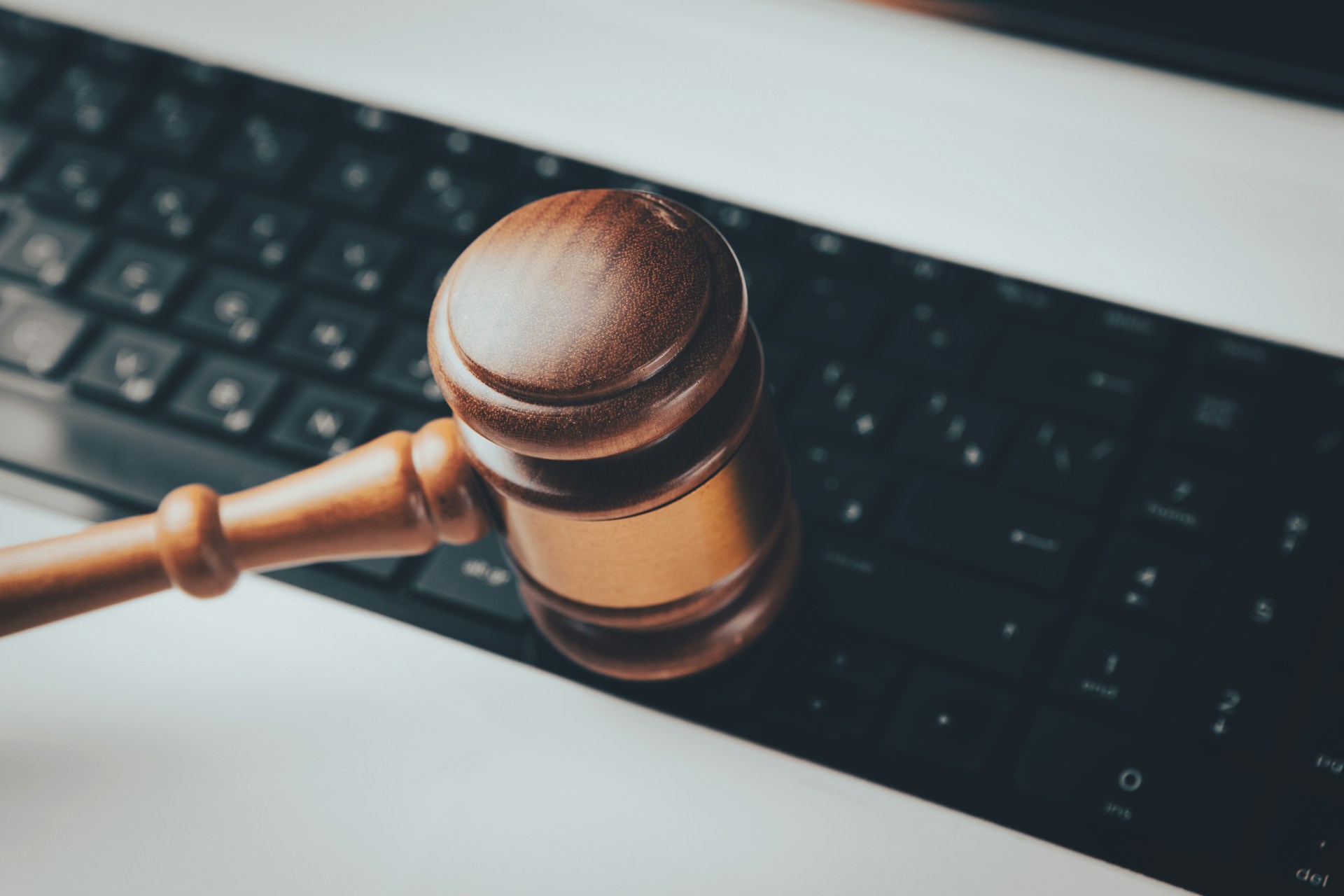 Gavel on laptop keyboard