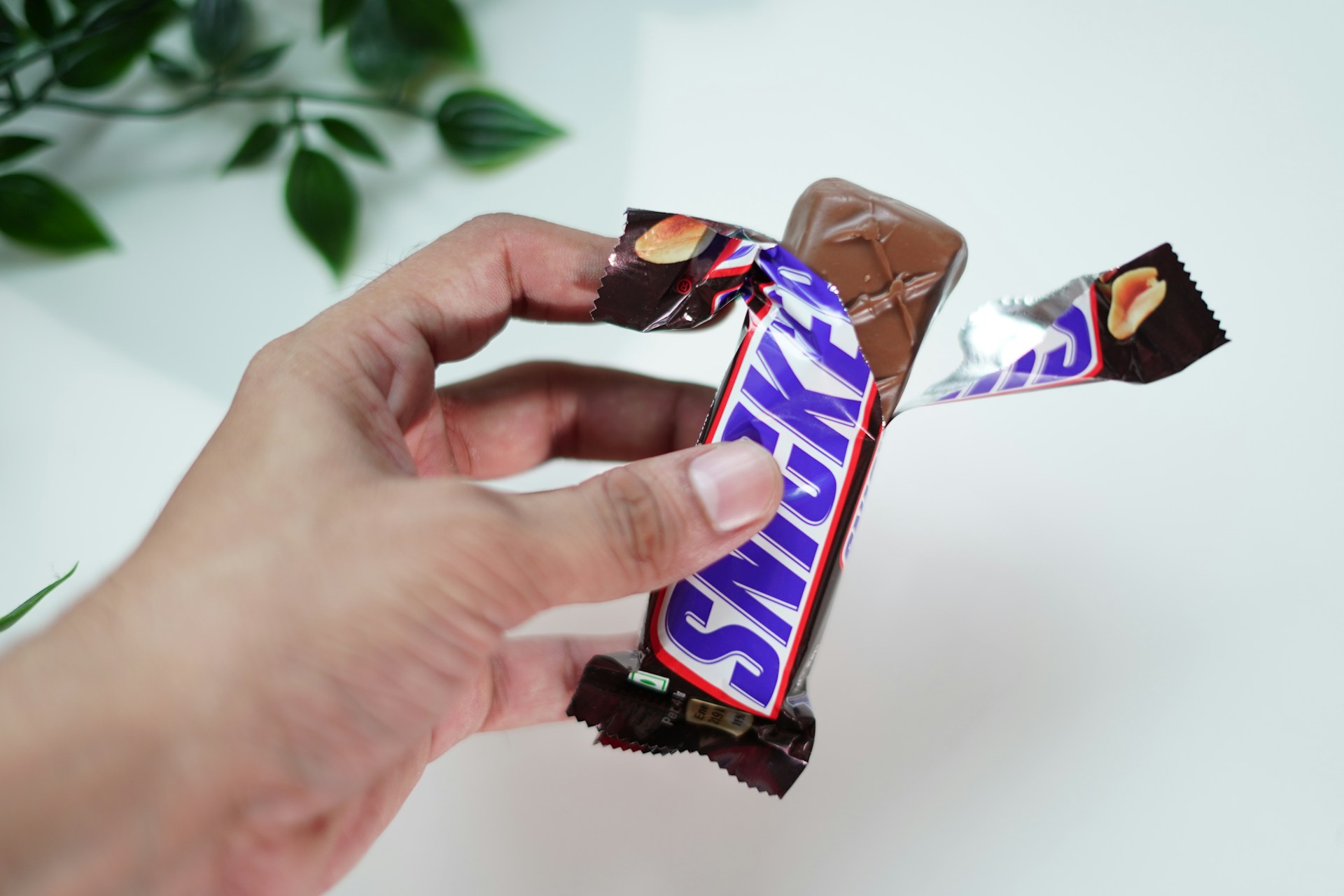 Snickers bars in hand