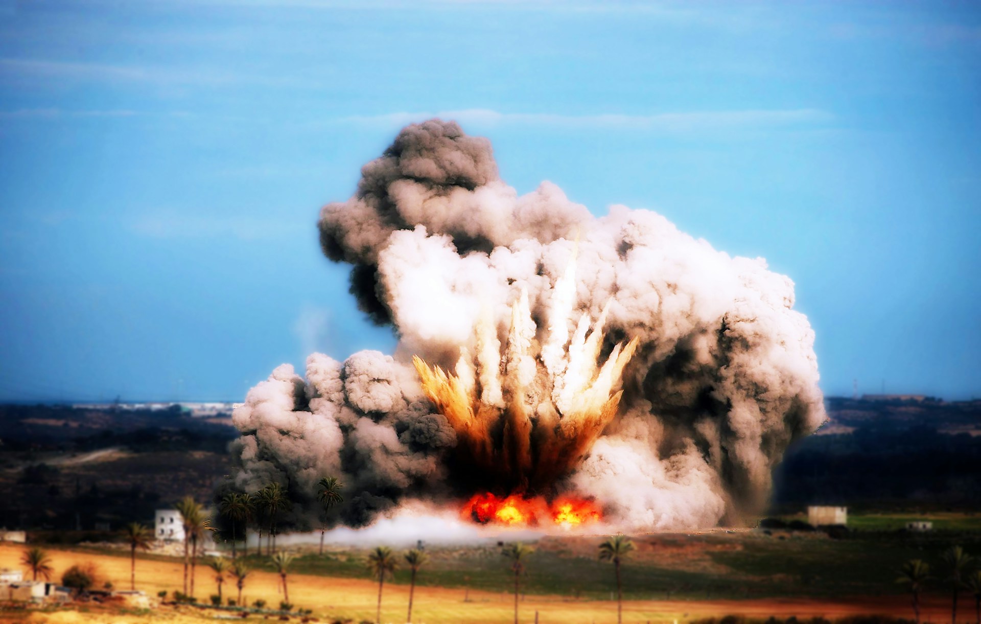 Weapon blast with cloud of smoke in the sky